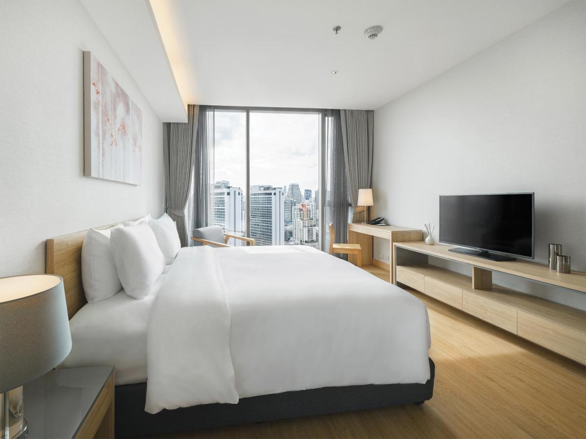 Oakwood Suites Bangkok - SHA Extra Plus Bagian luar foto Deluxe Room