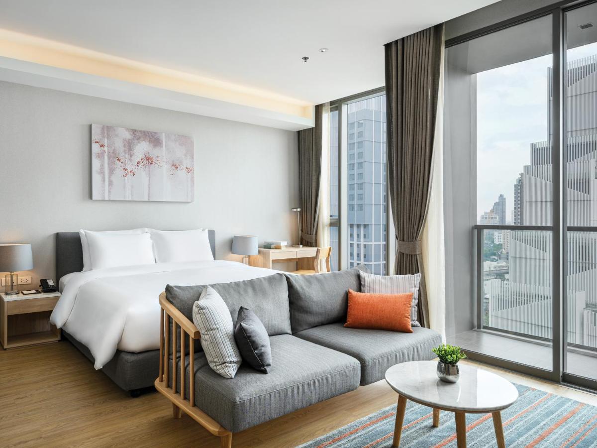 Oakwood Suites Bangkok - SHA Extra Plus Bagian luar foto Deluxe Room