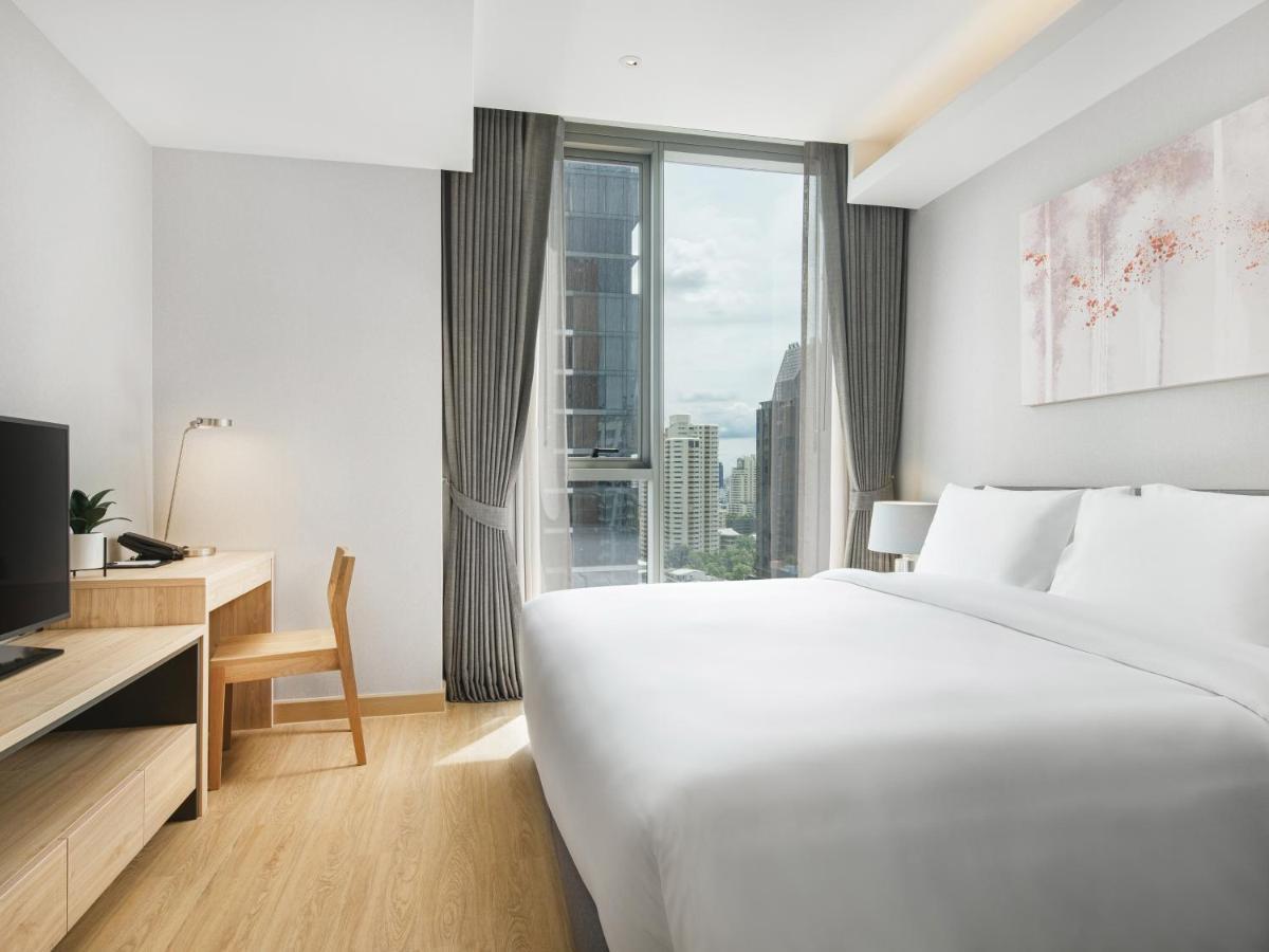 Oakwood Suites Bangkok - SHA Extra Plus Bagian luar foto Deluxe Room